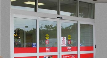 Store entrance automatic sliding glass doors